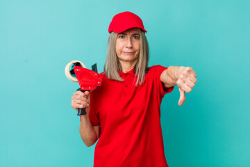 senior gray hair woman feeling cross,showing thumbs down. packer employee concept