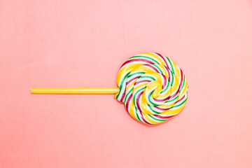 round lollipop candies isolated on pink background