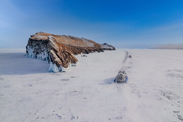 Winter tourism lake Baikal island Ogoy and hovercraft.