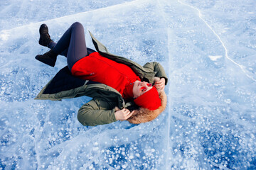 Adventure Tourist woman background ice with gas methane bubbles lake Baikal winter travel
