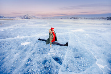Adventure Tourist woman background ice with gas methane bubbles lake Baikal winter travel