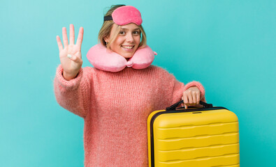 pretty blonde woman smiling and looking friendly, showing number four. flight passenger concept