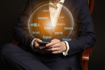 E-learning. Closeup businessman hands at work desk using mobile phone with creative grid of digital...