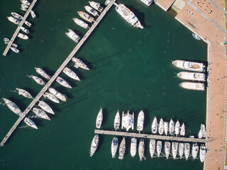 Fototapeta na wymiar Many Boats moored at dock or jetty top view, view from above, aerial view