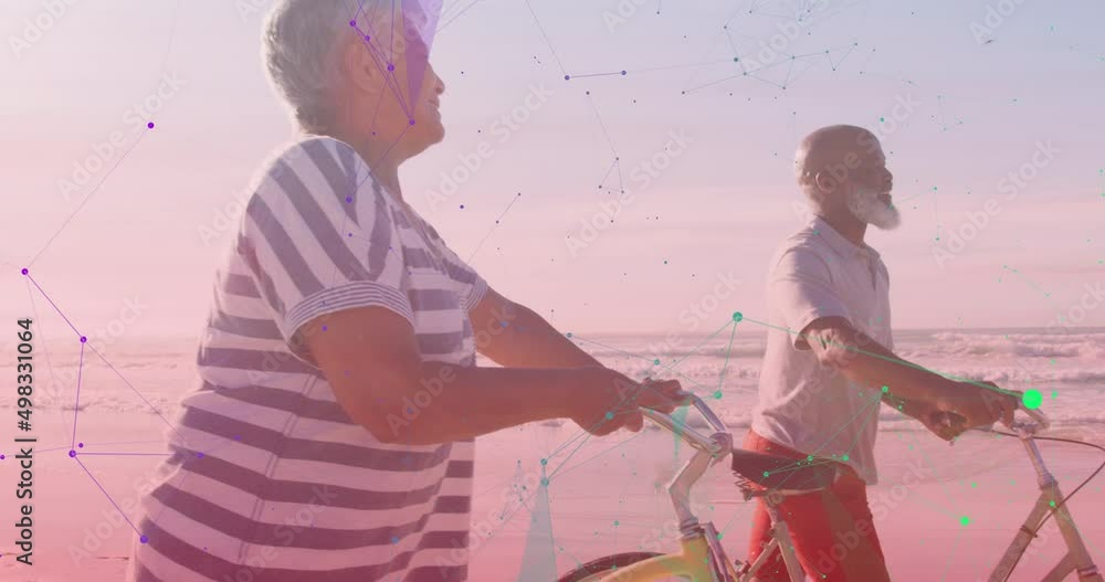 Canvas Prints Animation of shapes over happy senior african american couple with bicycles at beach