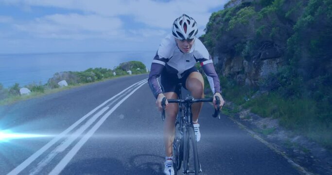 Animation of light spots over caucasian woman cycling