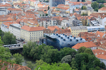 Graz, Austria-June 17 2017: View from the Castle Mountain to the city with the modern museum called...