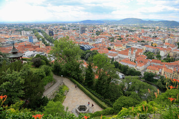 Fototapeta na wymiar View from the Castle Mountain with its botanical garden and the wooden Chinese Pavilion over the roofs to the City of Graz, Austria