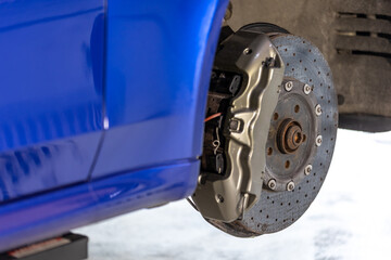Vehicle disc brake for repair, process of replacing a new tires, car brake repair in the garage,...