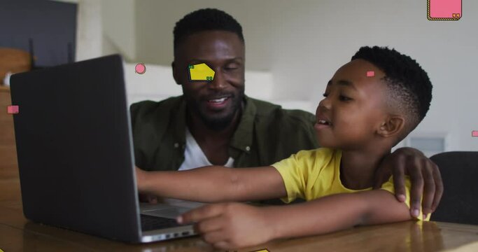 Animation of school items over happy african american father and son using laptop