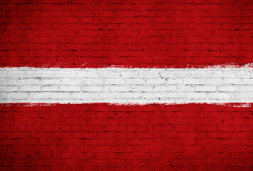 Latvia flag painted on brick wall. National country flag background photo
