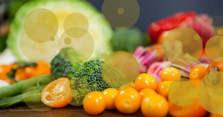 Animation of spots over fresh vegetables