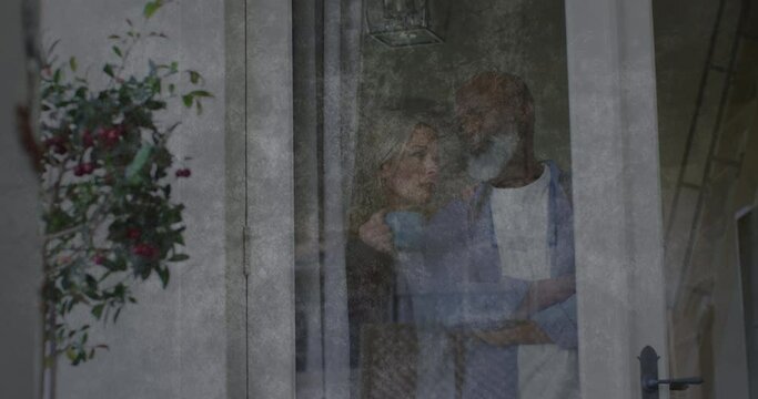 Animation of moving background over sad senior diverse couple embracing