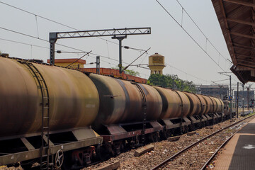 Fototapeta na wymiar Indian railway Freight Carrier train for carrying oil and Coal on 29th April 2024, Burdwan, India