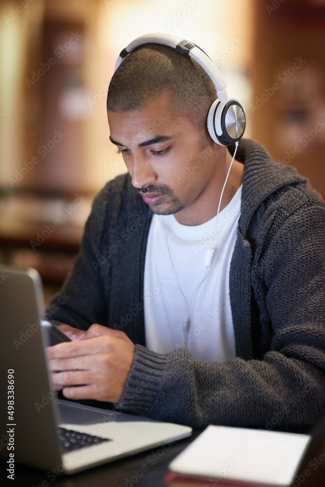 Aufkleber Im studying in the library if you want to join. Cropped shot of a college student texting on his cellphone while working at campus.