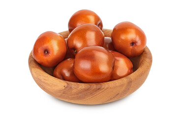 Obraz premium jujube or chinese date in wooden bowl isolated on white background with clipping path and full depth of field