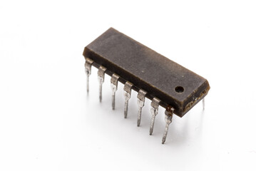 old electronic microcircuit on white background.