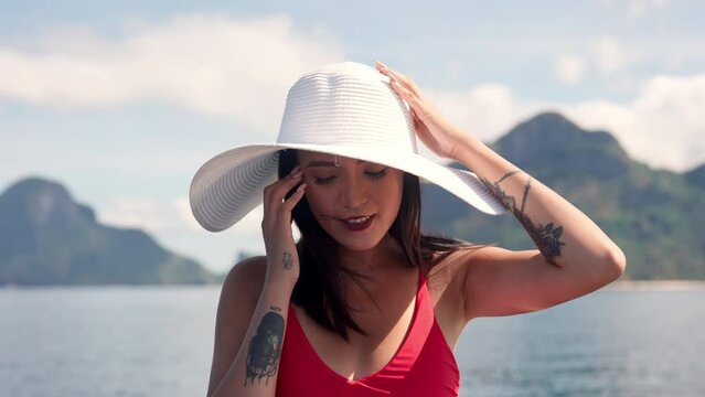 Young Woman In Sunhat, Smiling On Boat