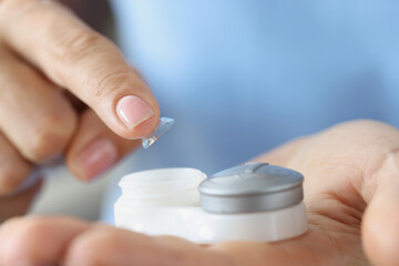 Soft contact lens and lens storage box closeup