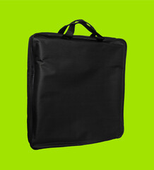 a simple bag made of material, black, for a laptop, on a light green background