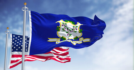 The Connecticut state flag waving along with the national flag of the United States of America