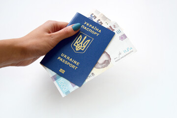 New banknotes in denominations of 500 and 1000 hryvnia with a Ukrainian passport.