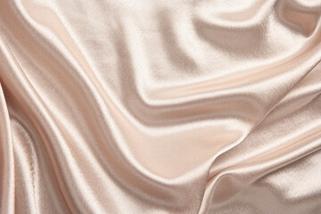 Top view on a natural luxury cream colour silk