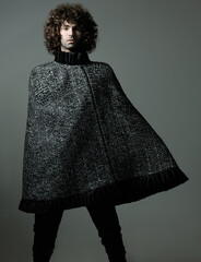 Fashion Model Posing, And  and Looking Confident In Studio With Avant Garde Clothes
