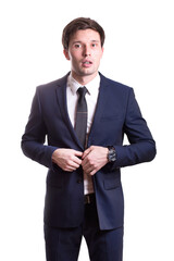 young white handsome man in a shirt strict office suit stands isolated on a white background