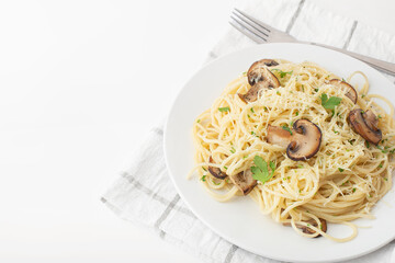 pasta with mushrooms and cheese on a white plate
