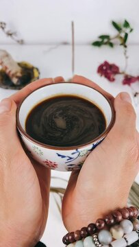 person holding a cup of coffee