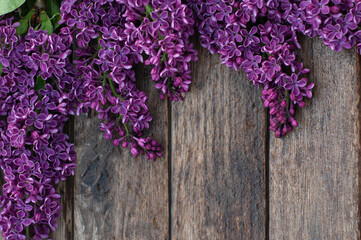 background with purple lilac on wooden background
