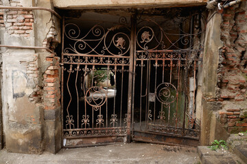 old, iron, scribbled gates in an old house