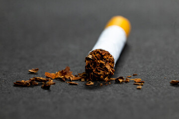 Tobacco  out of Cigarette With Black Background