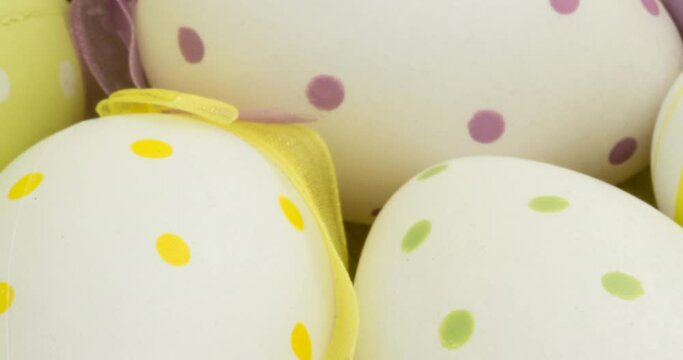Animation of easter eggs with spots and ribbons