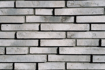 decorative handmade facade brick of gray color on the facade of a beautiful house