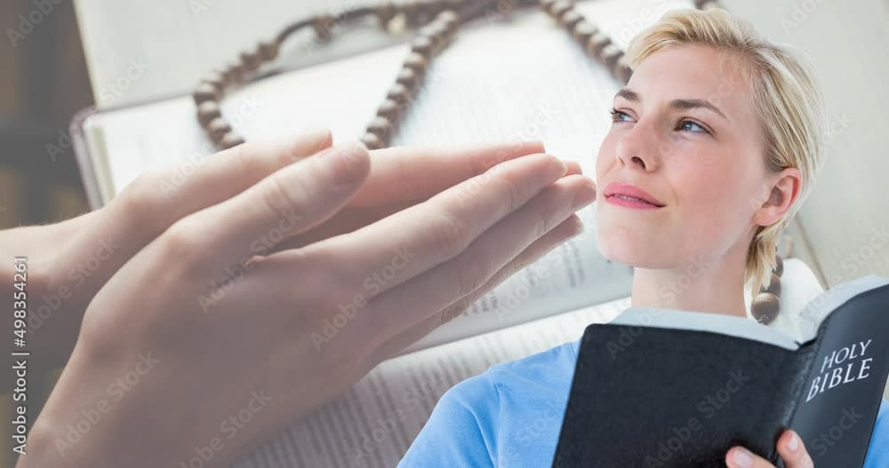 Wall mural animation of caucasian woman praying and holding holy bible with rosary in background - Wall murals
