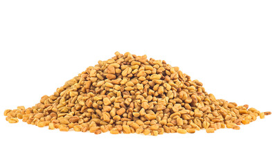 Dried fenugreek seeds isolated on a white background. Fenugreek seeds spices.