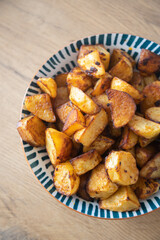 Roasted potatoes served in bowl