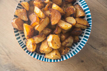 Roasted potatoes served in bowl