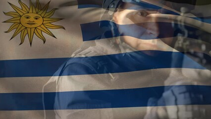 Animation of flag of uruguay over caucasian male soldier with weapon - Powered by Adobe