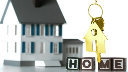 Animation of wooden blocks with text home and golden house shape with key over house - Powered by Adobe