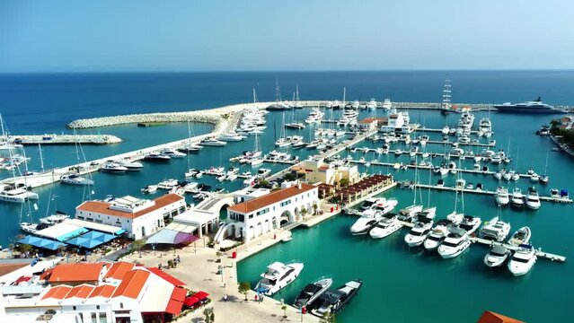 Drone flying over ships, yachts and boats in the old port in Limassol in Cyprus on a sunny spring day.