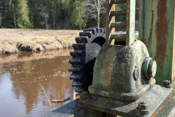A metal mechanism for raising the gate valves on the dam