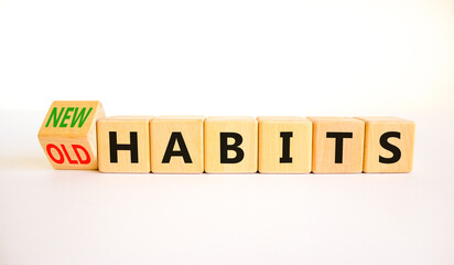 New or old habits symbol. Turned wooden cubes and changed concept words Old habits to New habits. Beautiful white table white background. Business old or new habits concept. Copy space.