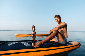 young man sitting on the SAP board .