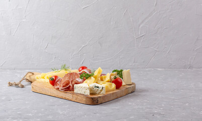 Appetizers table with differents antipasti, charcuterie, snacks and cheese. Buffet party. Top view,...