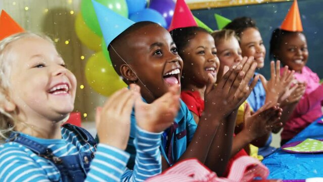 Animation of snow falling over diverse children with party hats at birthday party