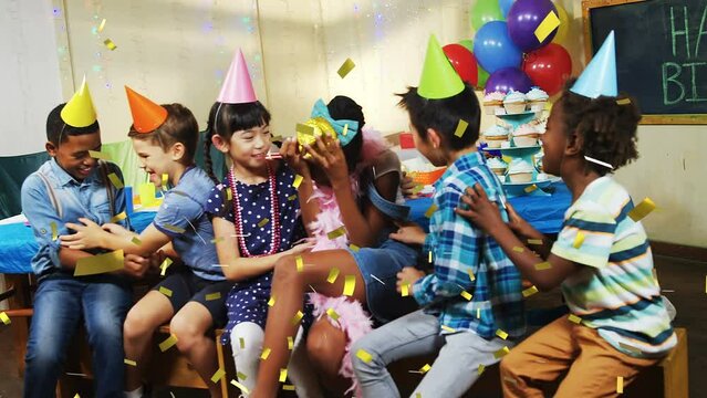Animation of confetti falling over diverse children with party hats at birthday party