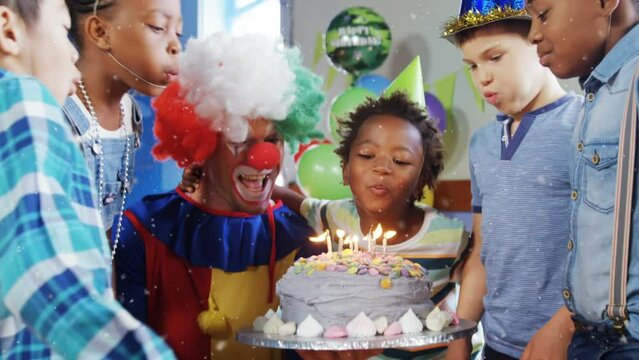 Animation of snow falling over diverse children and clown at birthday party